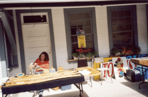 Jodi's Mom selling her hiking sticks